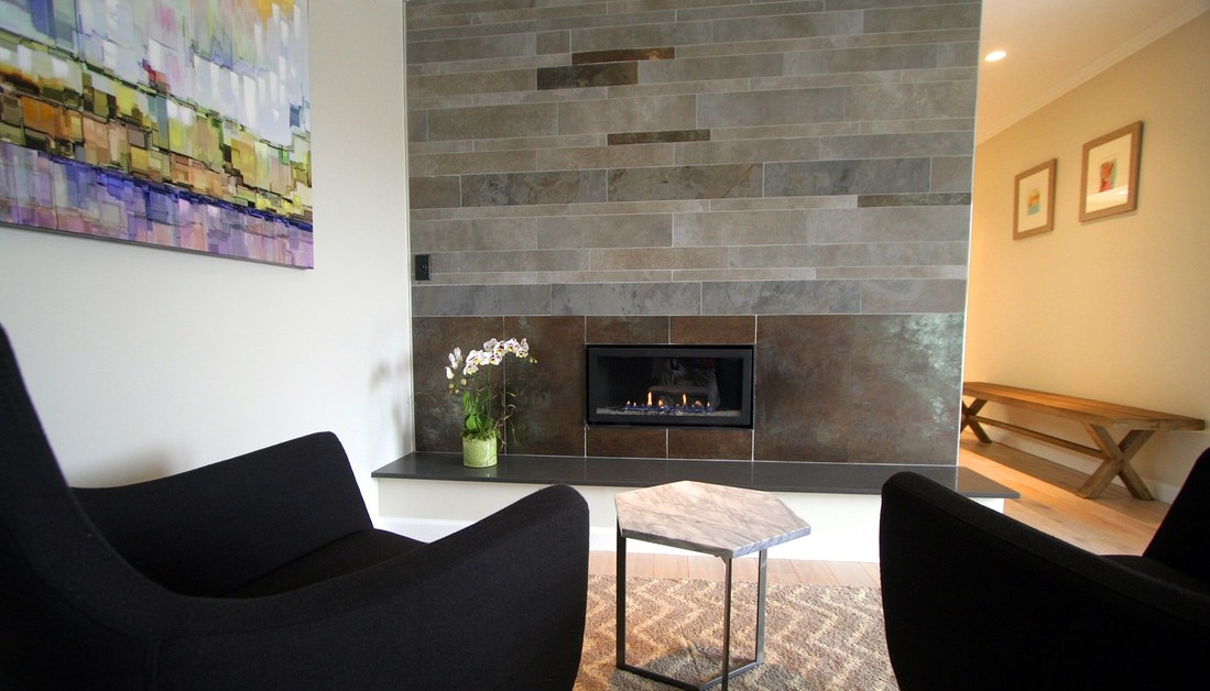 two chairs near a modern fireplace